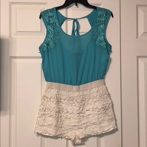 A romper. Green on top, white lace bottom